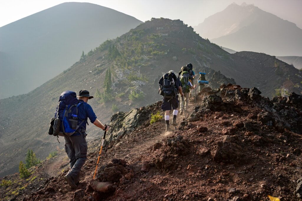 Trekking with Purpose: Sustainable Practices for Eco-Friendly Adventures 5 Group of Person Walking in Mountain