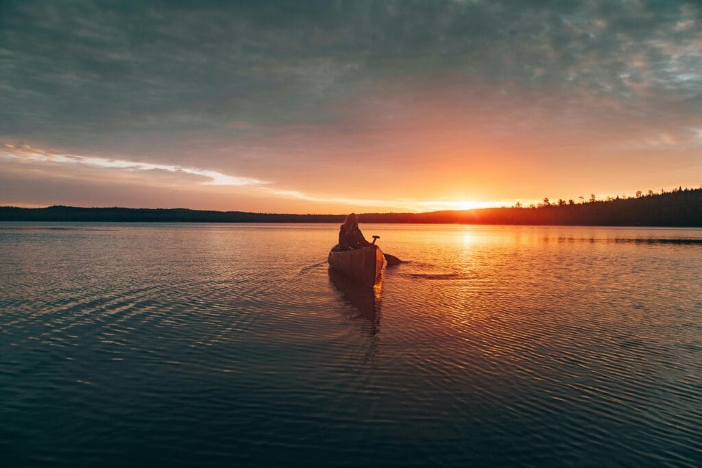 Sustainable Water-Based Activities: Canoeing and Kayaking in Tanzania’s Lakes 16 Photo of Person Riding Kayak