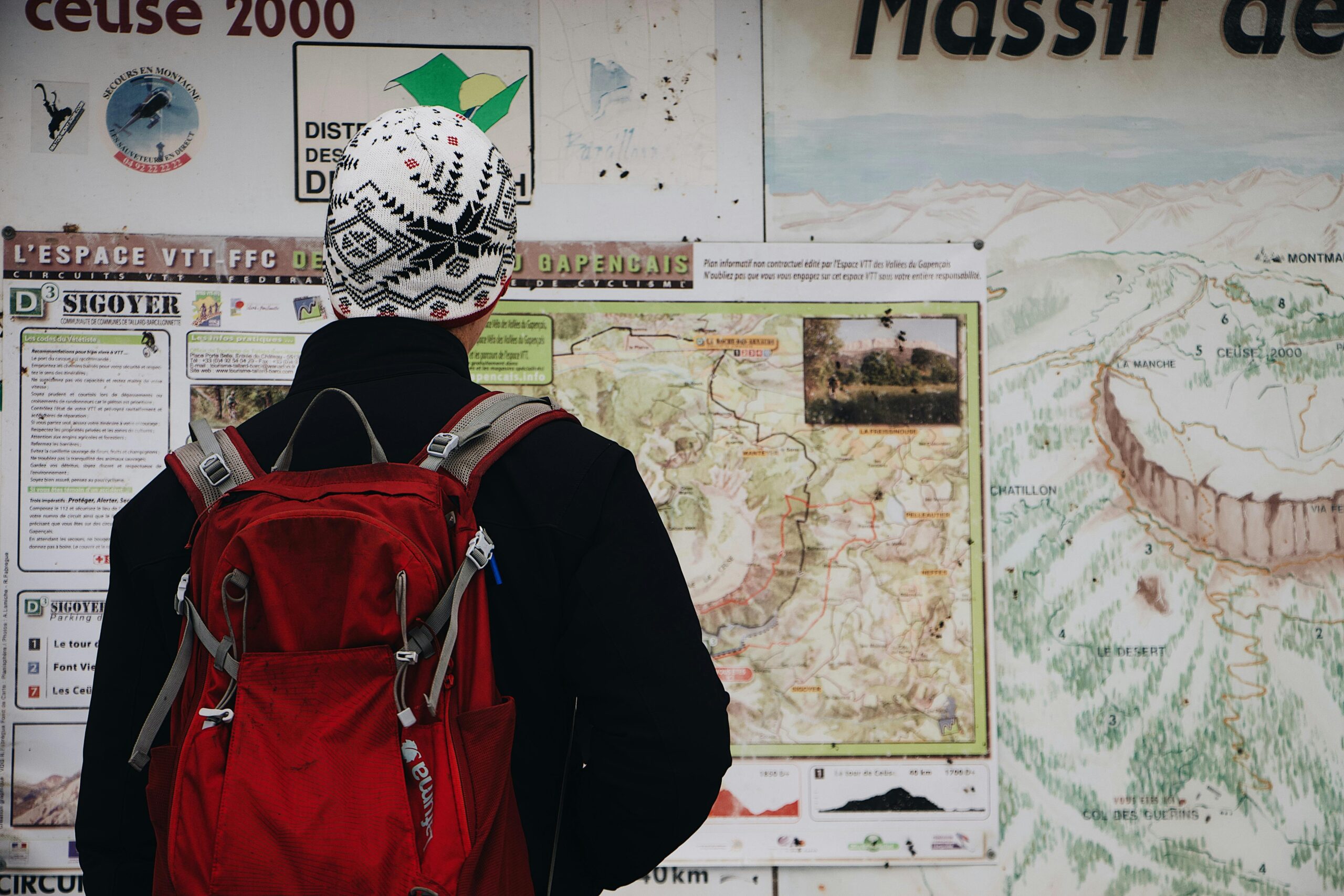 Man Standing in Front of Map