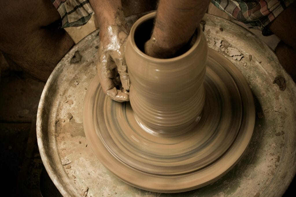 Crafting Memories: Traditional Tanzanian Pottery and Ceramics Workshops 31 Person Making Pot