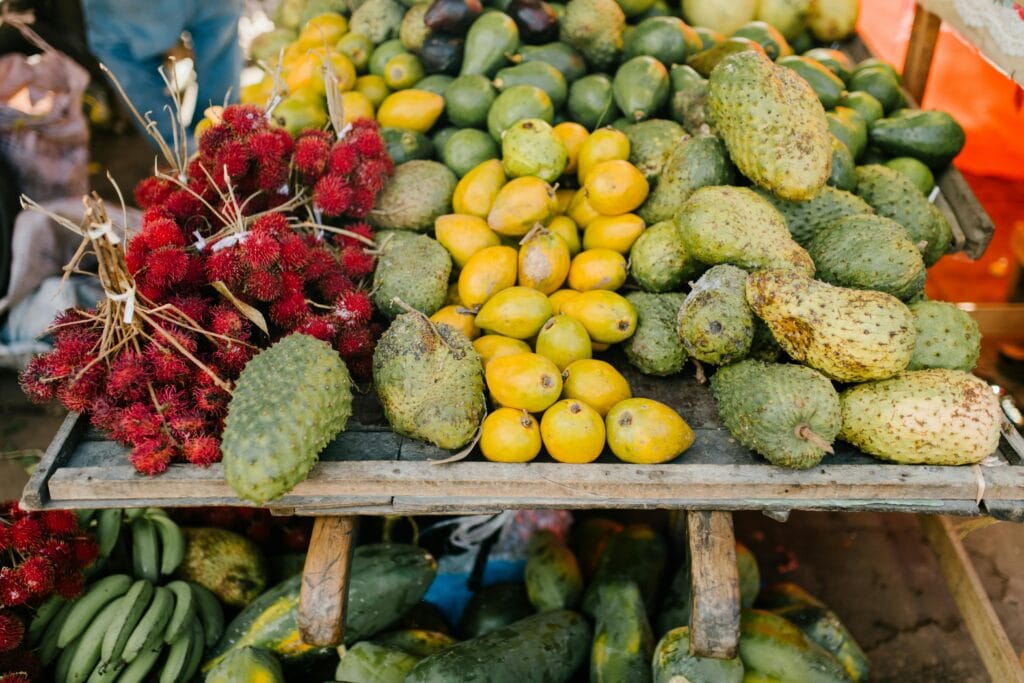 A Guide to Zanzibar’s Tropical Fruits: From Mangos to Jackfruit 9 Assorted tropical fruits on stall at market