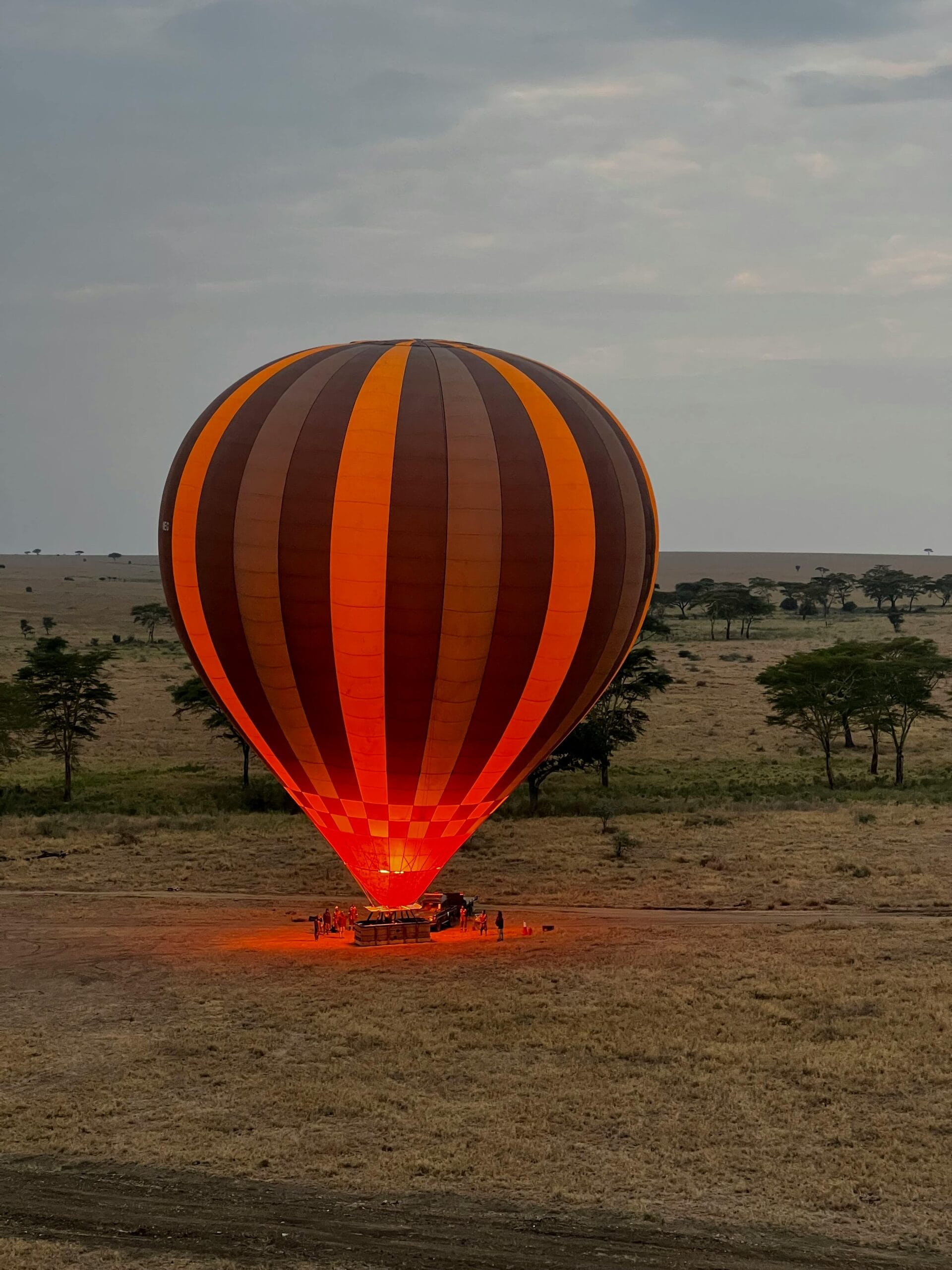 2-Day Serengeti Balloon Safari with Camping Adventure: A Thrilling Wildlife Experience 1 Vibrant hot air balloon floating over the expansive Serengeti grasslands in Tanzania.