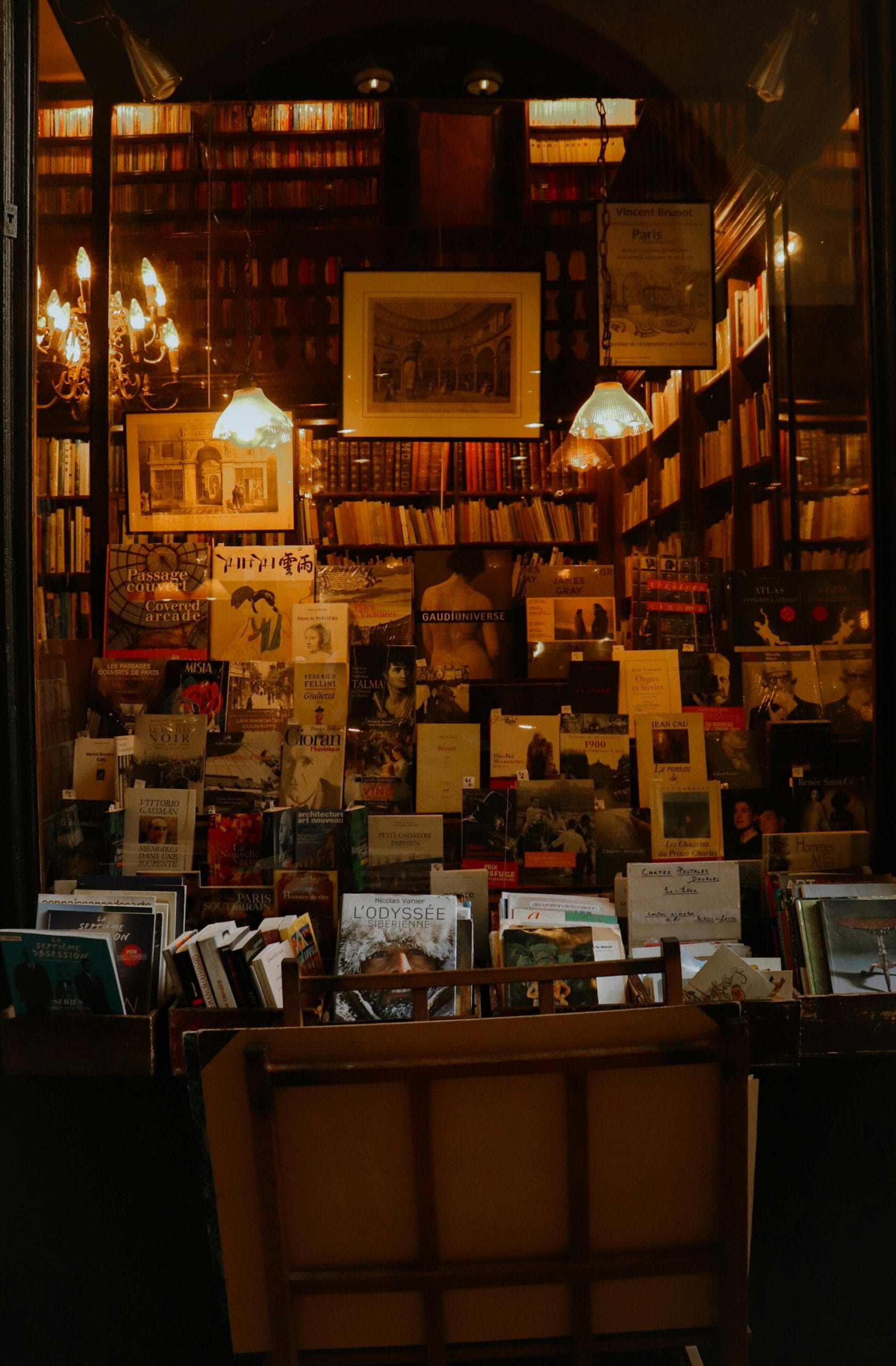Must-visit galleries and art shops in Zanzibar 1 Warm-lit Parisian bookstore filled with books and art. Perfect for book lovers.