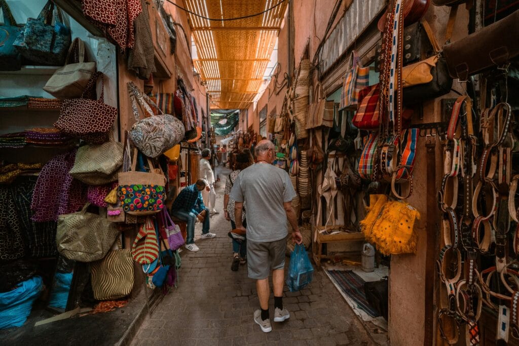 How Safari Tourism Supports Local Crafts: Preserving Culture and Empowering Communities 11 Explore the bustling souk in Marrakech with colorful textiles and local crafts on display.