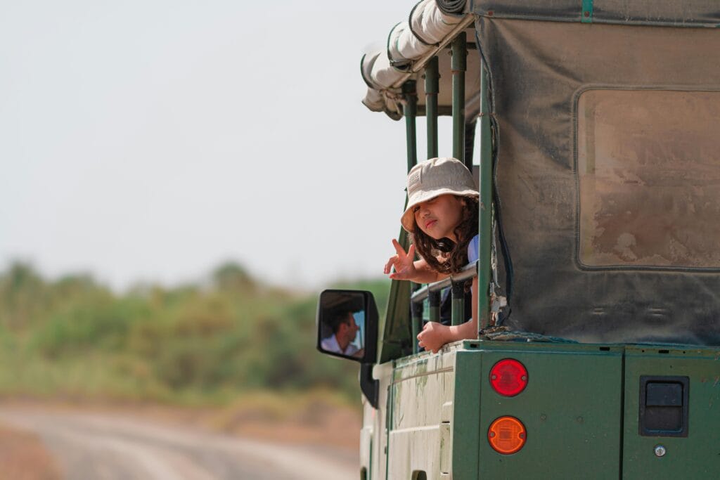 How to Keep Kids Entertained on Safari: A Family-Friendly Guide 25 Child on Safari Adventure in Open-Top Vehicle