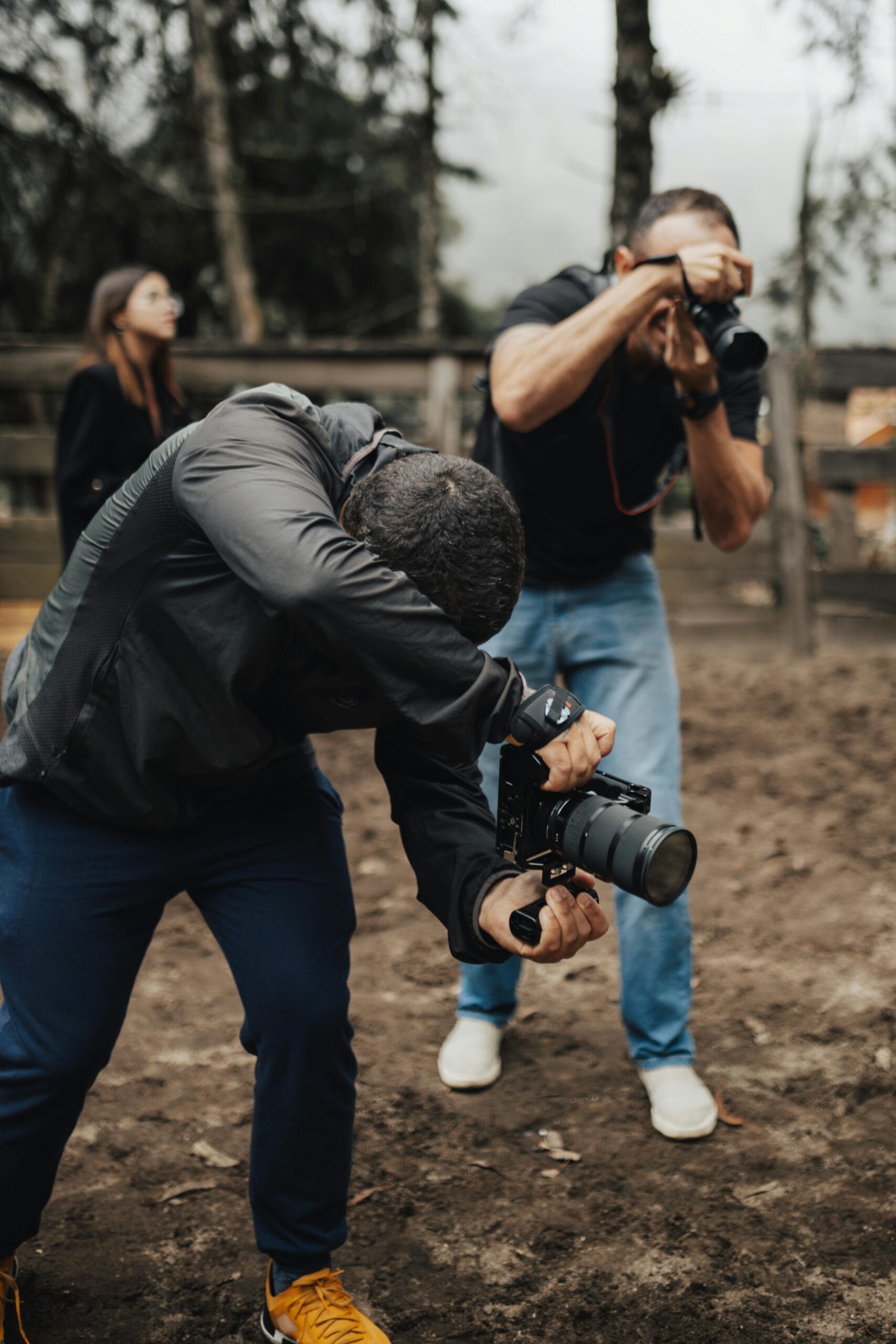 Photography Tips for Capturing Wildlife on Safari 1 Two photographers outdoors capturing dynamic shots with DSLRs, showcasing creativity.