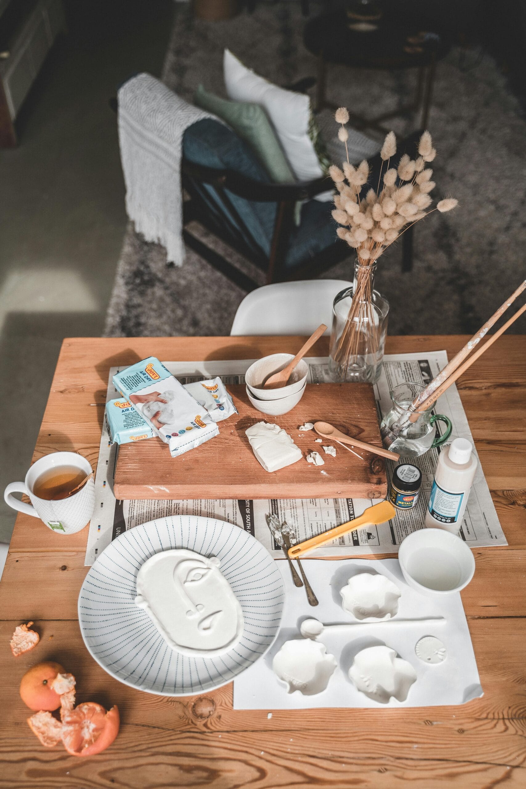 Supporting Local Crafts in Tanzania: A Journey Through Art, Culture, and Community 2 An artistic pottery workspace with tools, clay, and creative decor perfect for home crafting.
