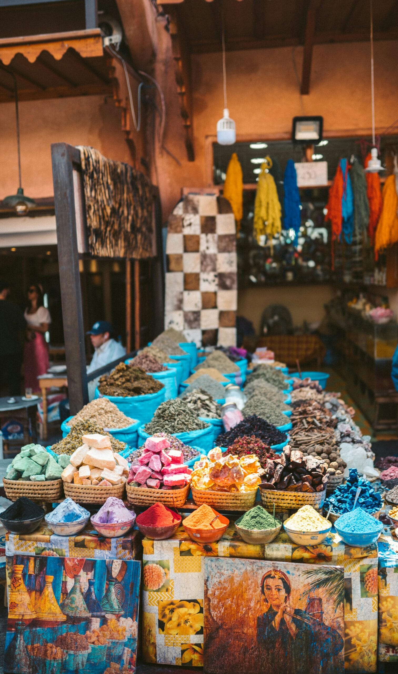 Conserving culture through tourism 1 Colorful spices and fabrics displayed at an outdoor market in Marrakesh, Morocco.