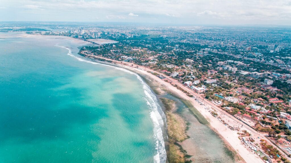 Aerial shot of Dar es Salaam's coastline showcasing the vibrant cityscape and turquoise waters.