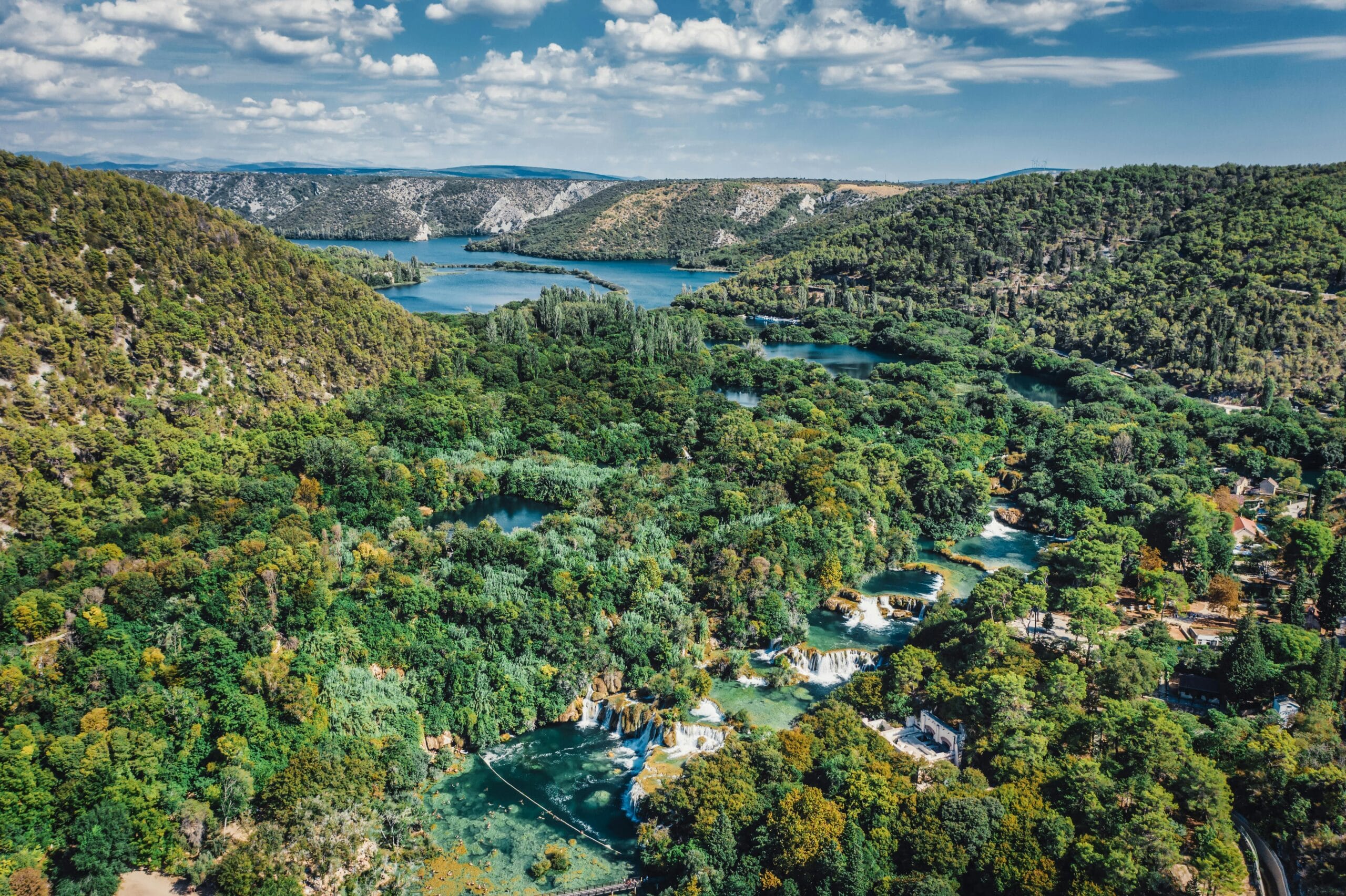 A breathtaking aerial view of lush greenery and waterfalls in Krka National Park, Croatia.