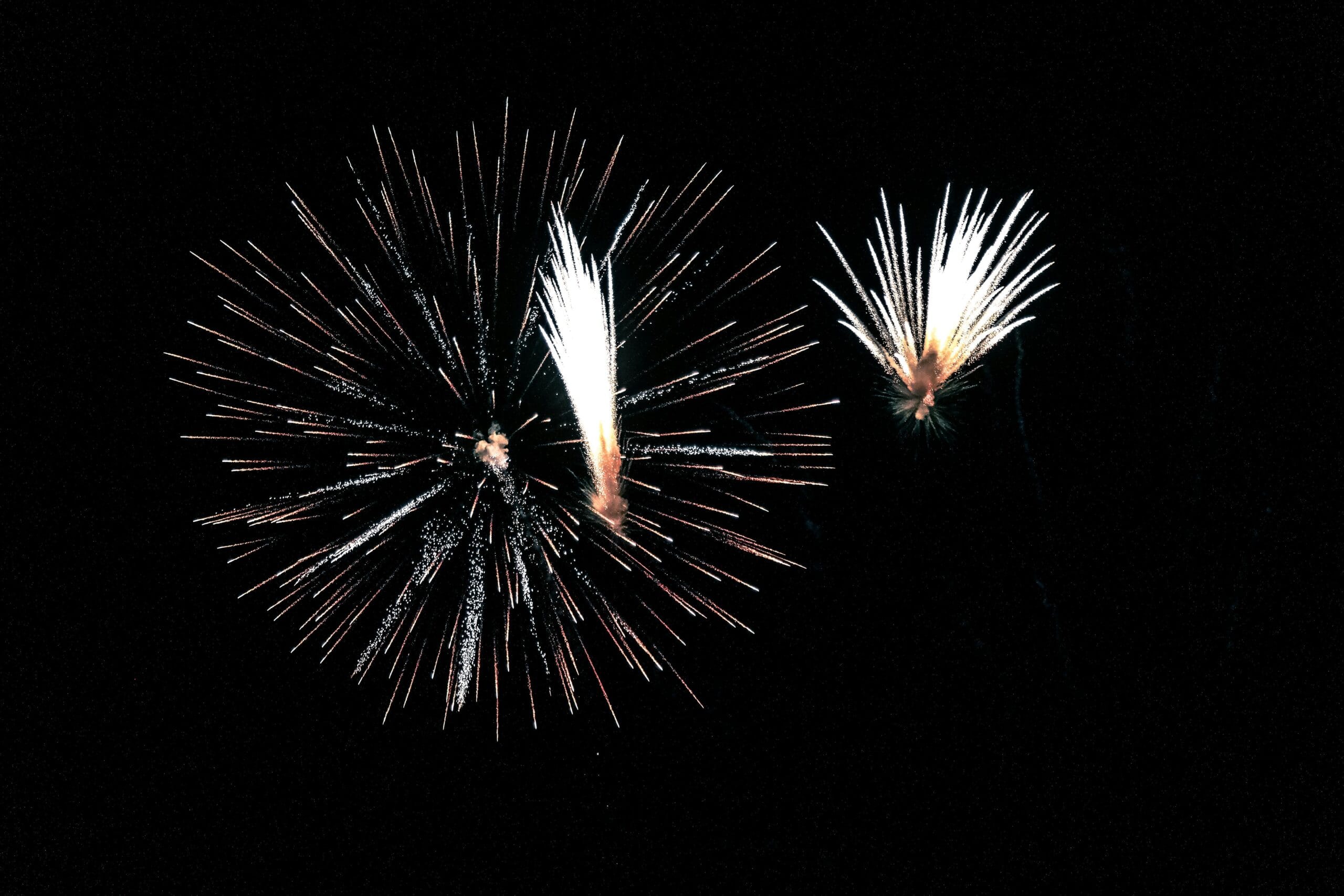 Dynamic fireworks bursting in a clear night sky, perfect for celebrations.