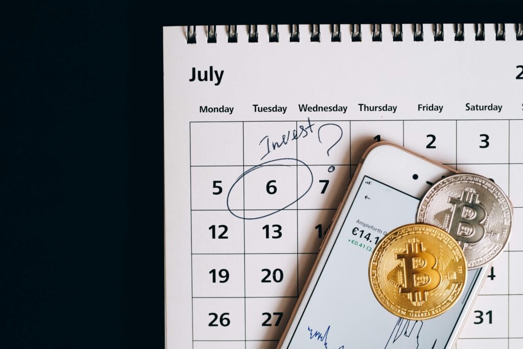 Best deals for July safaris 7 Smartphone with bitcoins on calendar, marking investment date.