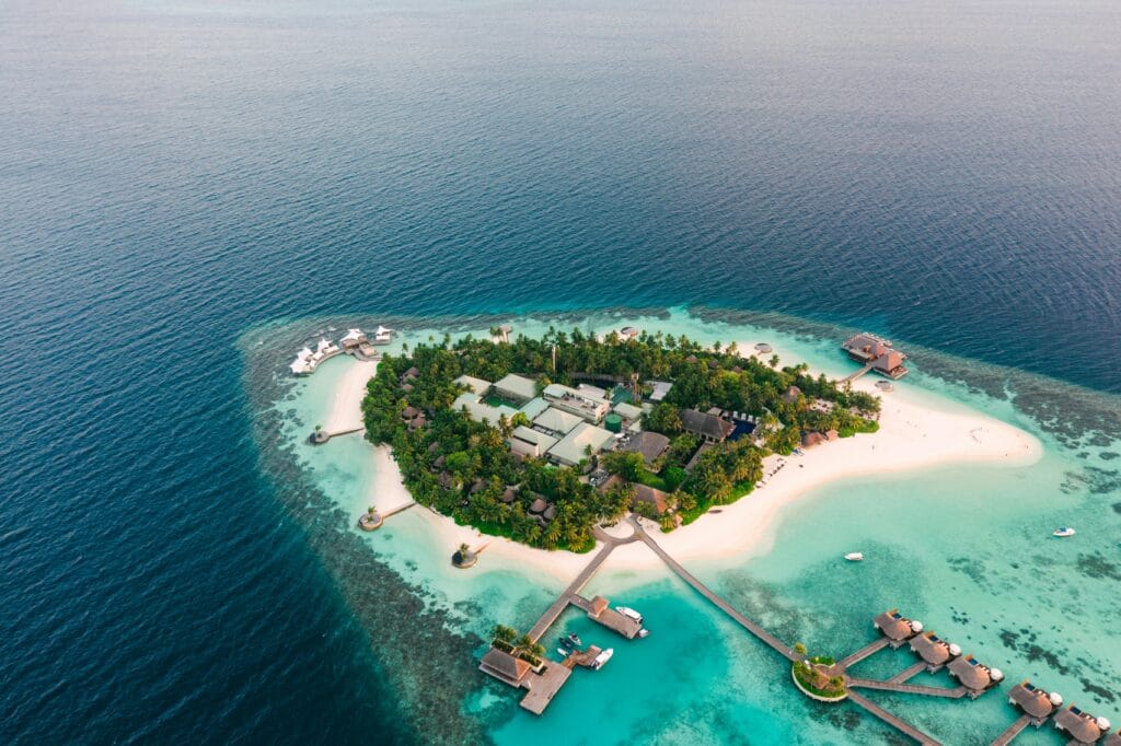 7-Day Safari and Beach Combo with Private Guide: The Ultimate Tanzanian Escape 16 Discover a breathtaking tropical island resort surrounded by azure waters and lush greenery.