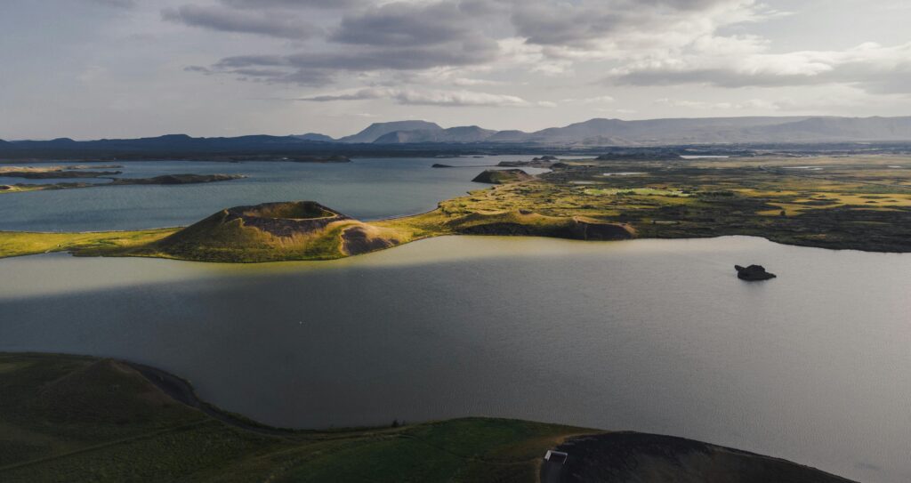 A breathtaking aerial view of Iceland's serene lakes and volcanic landscapes bathed in gentle light.