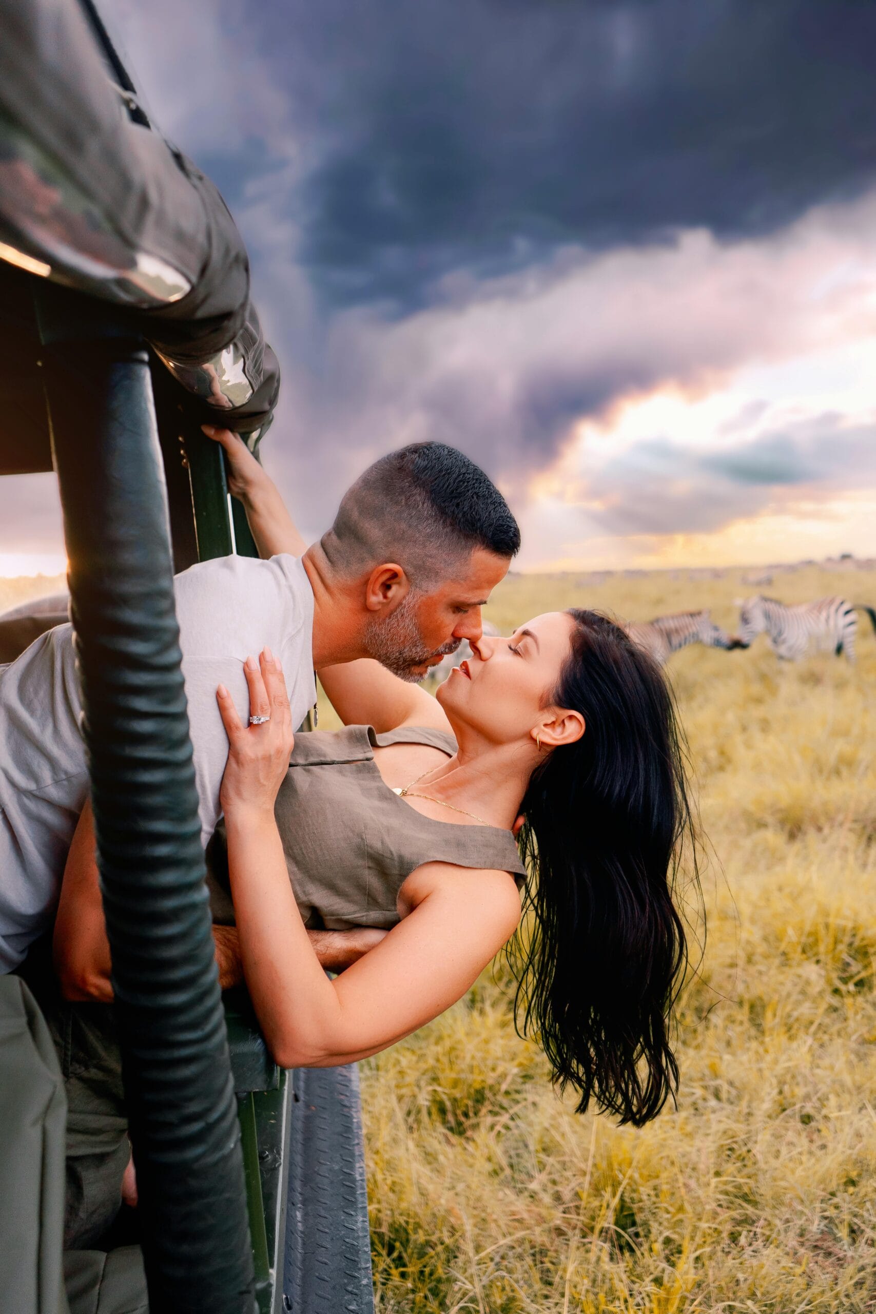 15 Days Tanzania Honeymoon Safari & Zanzibar Vacation 1 Romantic couple kissing during a safari adventure in Nairobi, Kenya.
